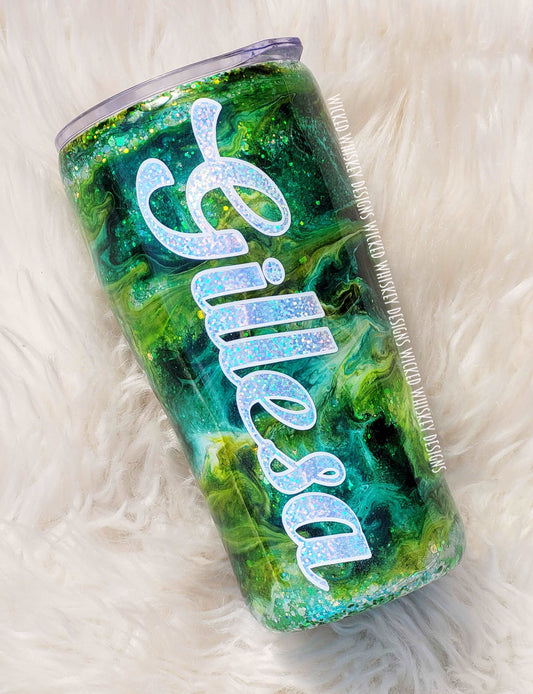 This Green Peekaboo Alcohol Ink Glitter Tumbler is next level stunning!! Your color choice of alcohol ink swirled over a chunky glitter base makes this peekaboo tumbler impossible to miss!