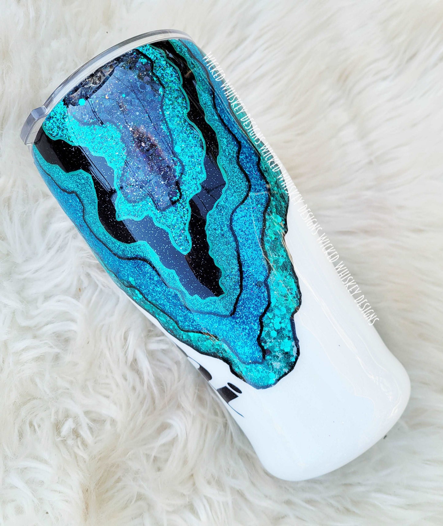 This black and teal geode tumbler is unique and the perfect personalized custom glitter tumbler!